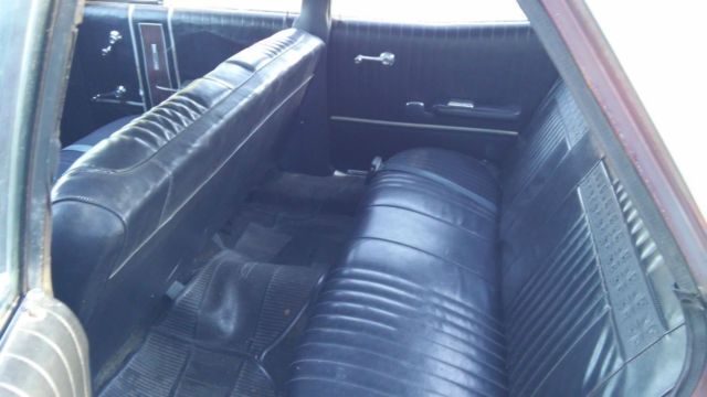 1967 white and brown Ford Galaxie Sedan