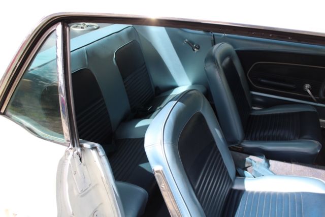 1967 blue on white Ford Mustang Coupe
