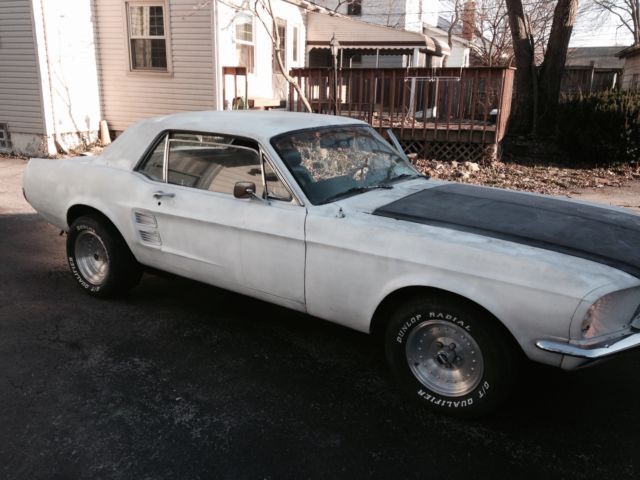 1967 blue on white Ford Mustang Coupe
