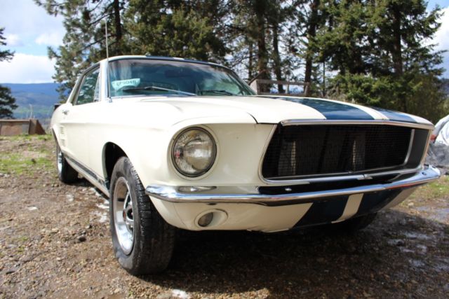 1967 blue on white Ford Mustang Coupe