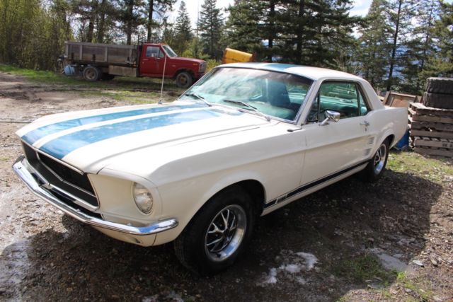 1967 blue on white Ford Mustang Coupe