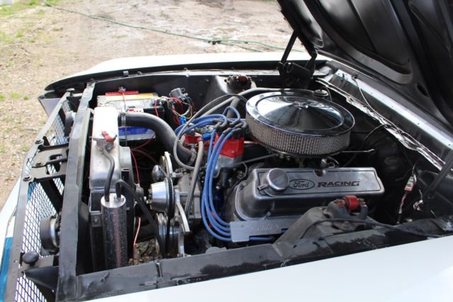 1967 blue on white Ford Mustang Coupe