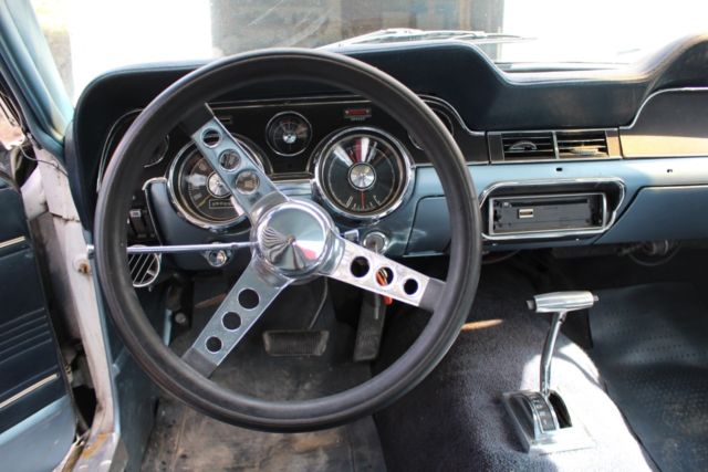 1967 blue on white Ford Mustang Coupe