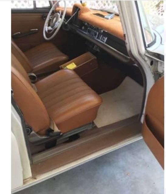 1967 cream Mercedes-Benz 200-Series