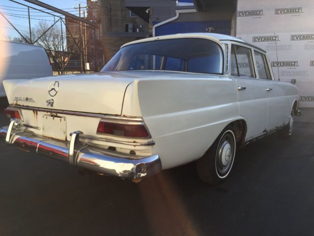 1967 White Mercedes-Benz 200-Series Sedan