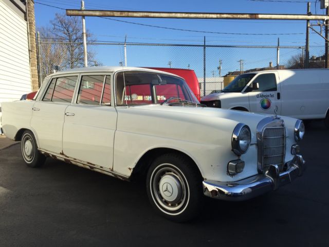 1967 White Mercedes-Benz 200-Series Sedan