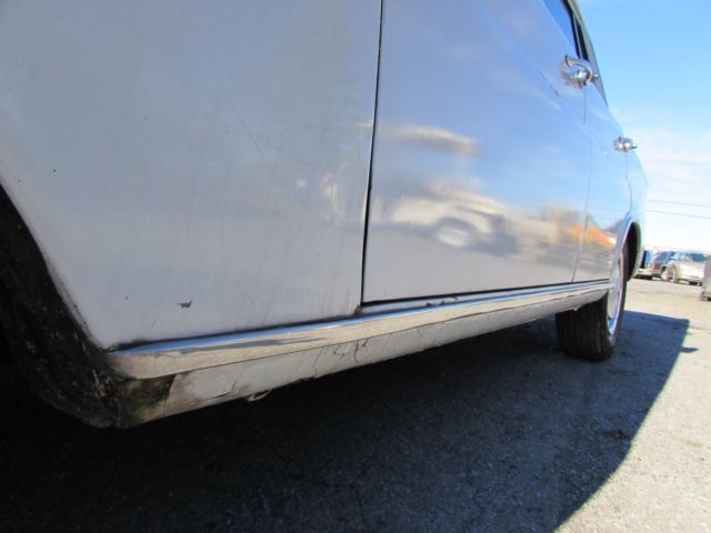 1967 White Mercedes-Benz 200-Series Sedan