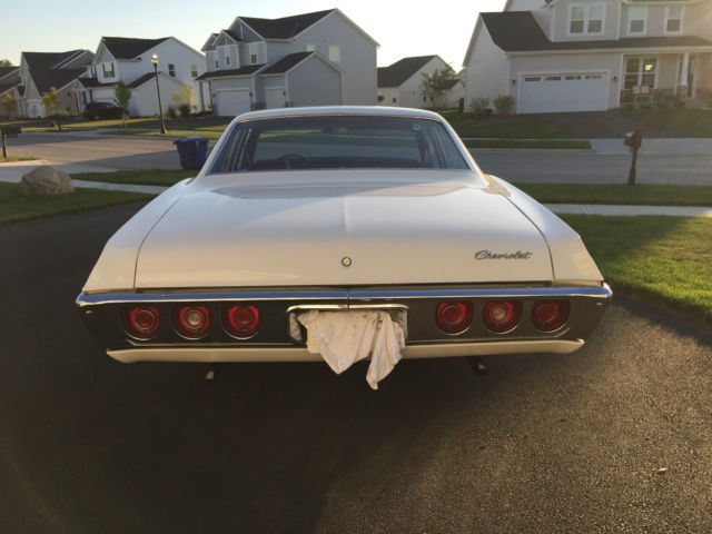 1968 white Chevrolet Impala Sedan