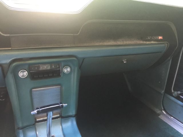 1968 turquoise Ford Mustang Convertible