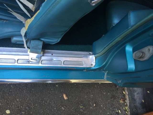 1968 turquoise Ford Mustang Convertible