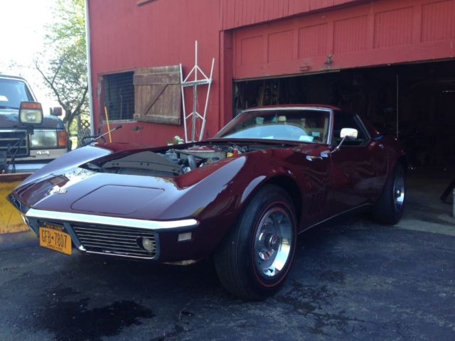 1968 maroon Chevrolet Corvette Convertible
