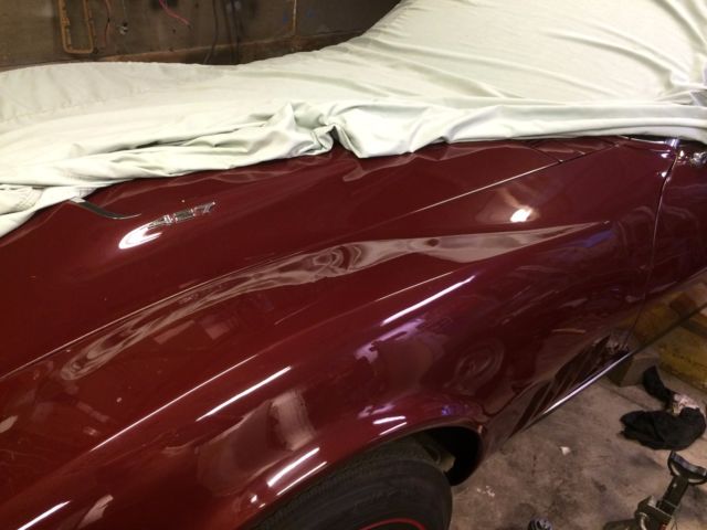 1968 maroon Chevrolet Corvette Convertible