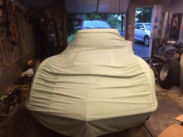 1968 maroon Chevrolet Corvette Convertible