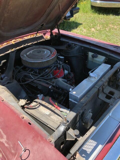 1968 maroon Ford Mustang Coupe