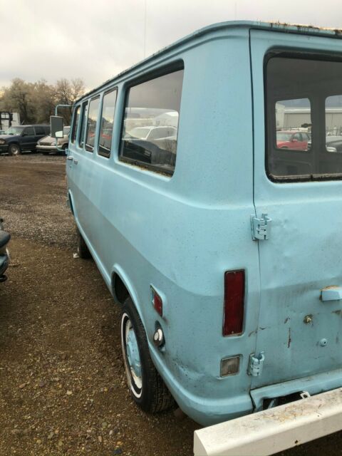 1968 blue GMC Handibus Extended Passenger Van