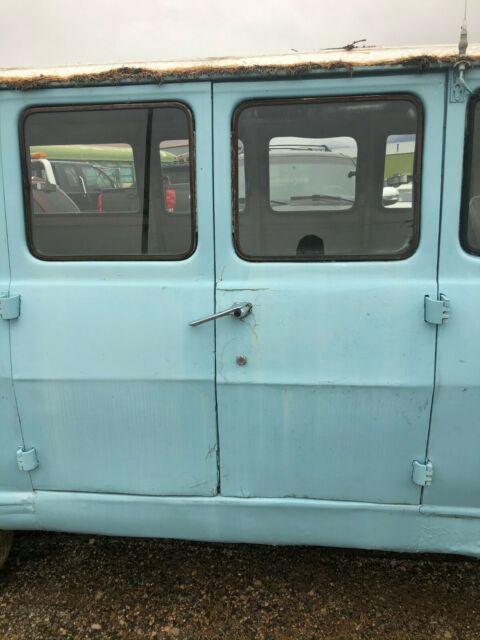 1968 blue GMC Handibus Extended Passenger Van