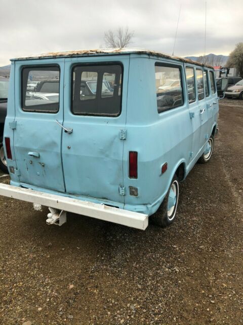 1968 blue GMC Handibus Extended Passenger Van