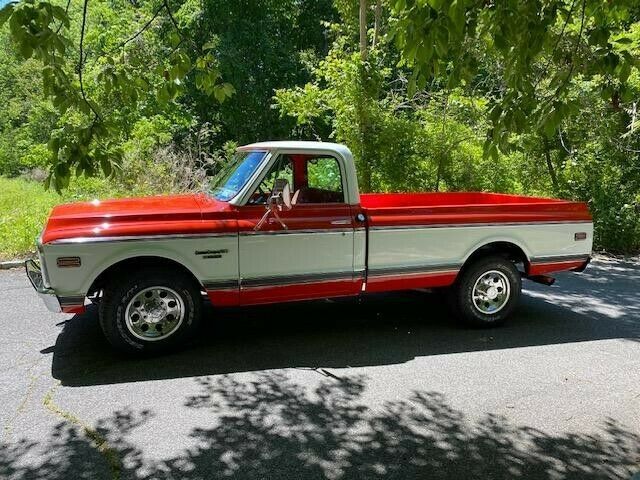 1969 orange and white Chevrolet C20 Standard cab long bed pickup