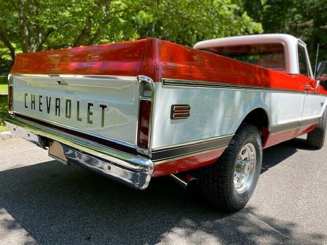 1969 orange and white Chevrolet C20 Standard cab long bed pickup