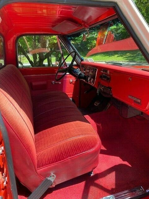 1969 orange and white Chevrolet C20 Standard cab long bed pickup