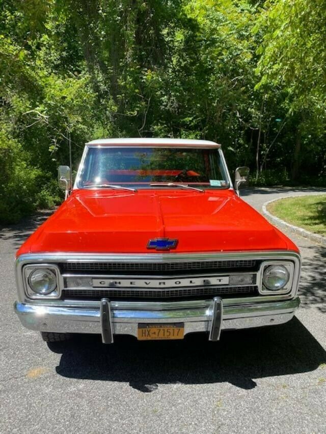 1969 orange and white Chevrolet C20 Standard cab long bed pickup