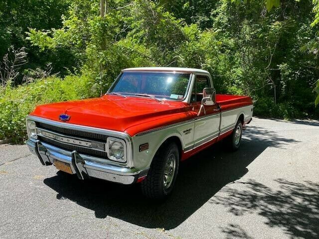 1969 orange and white Chevrolet C20 Standard cab long bed pickup
