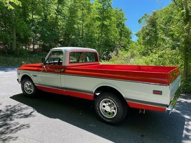 1969 orange and white Chevrolet C20 Standard cab long bed pickup