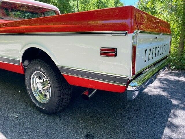 1969 orange and white Chevrolet C20 Standard cab long bed pickup