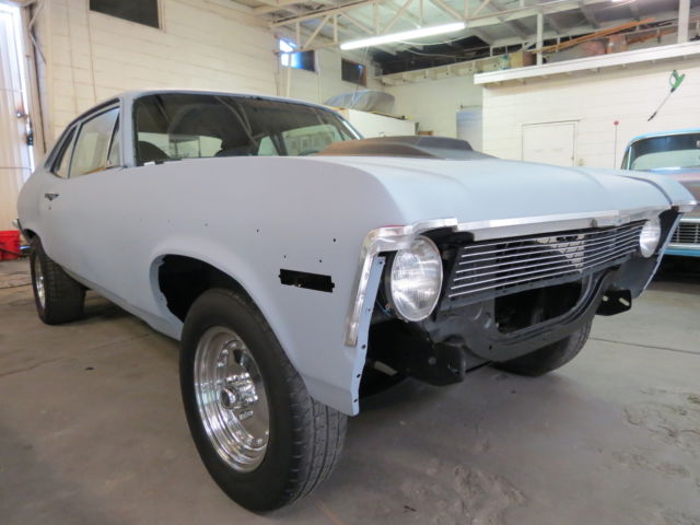 1969 gray primer Chevrolet Nova 2 door sedan