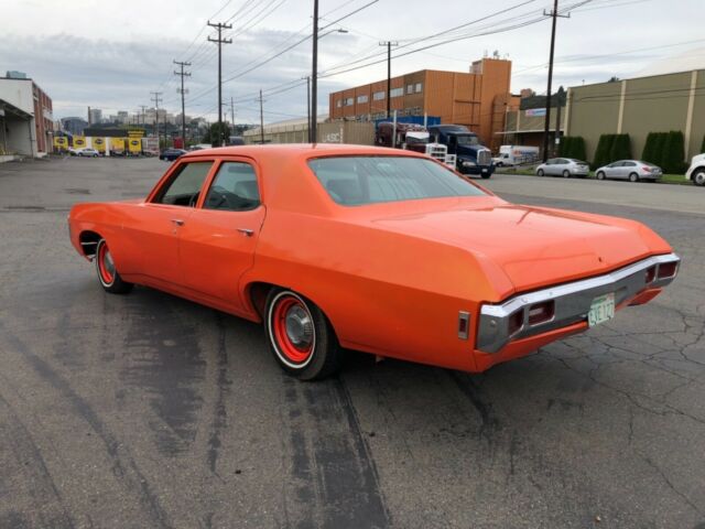 1969 Orange Chevrolet Impala Sedan