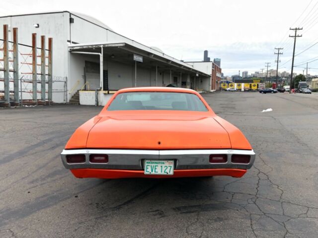 1969 Orange Chevrolet Impala Sedan