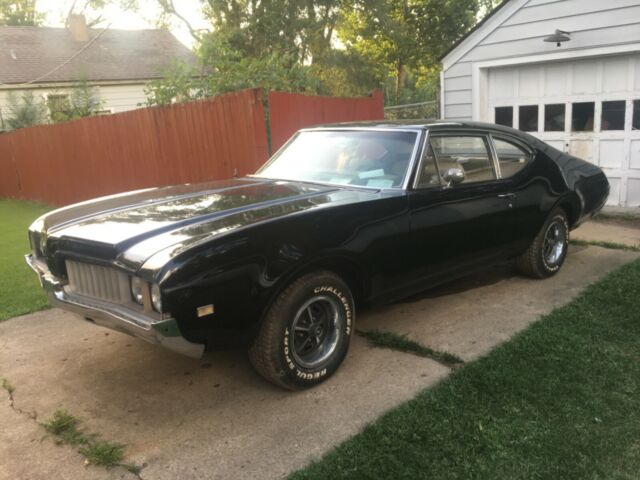 1969 black Oldsmobile Cutlass Sedan