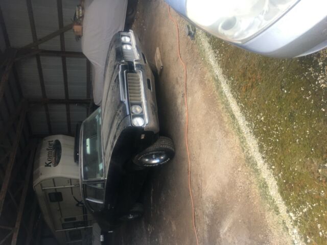 1969 black Oldsmobile Cutlass Sedan