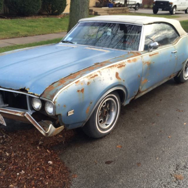 1969 blue Oldsmobile Cutlass Convertible