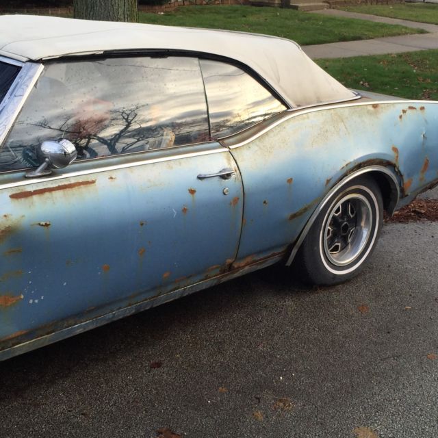 1969 blue Oldsmobile Cutlass Convertible