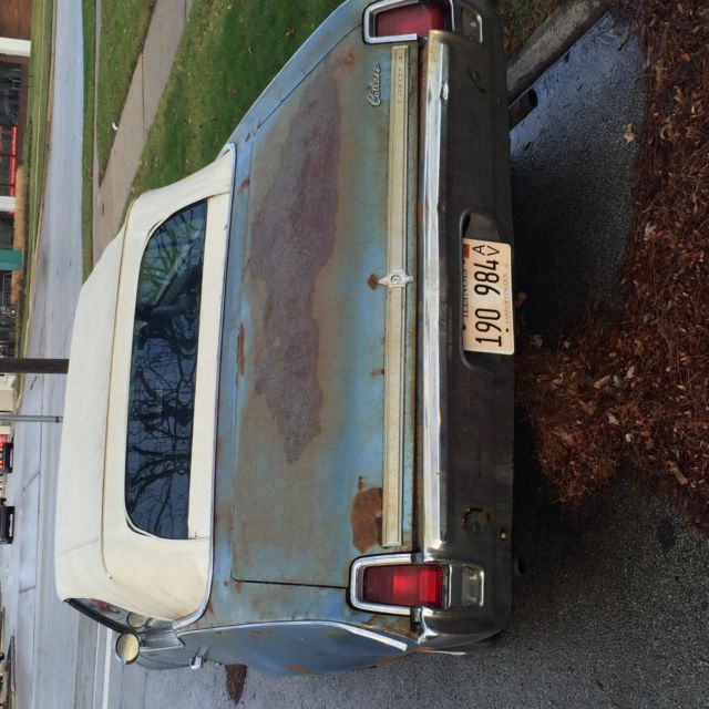 1969 blue Oldsmobile Cutlass Convertible