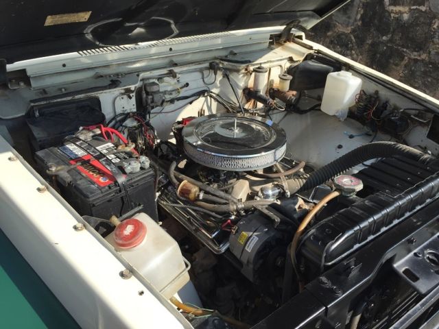 1969 green/white Toyota Land Cruiser 4-dr pig