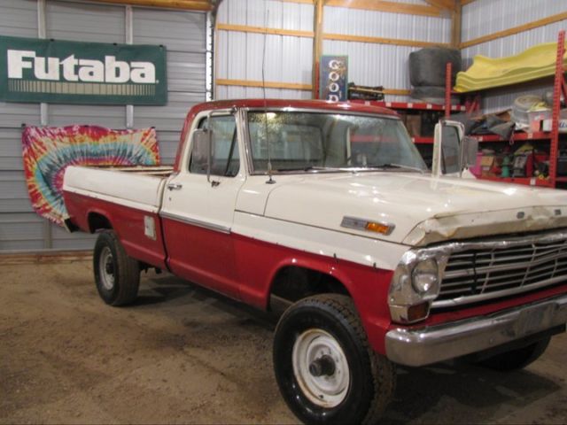 1969 red and white Ford F-250 pickup