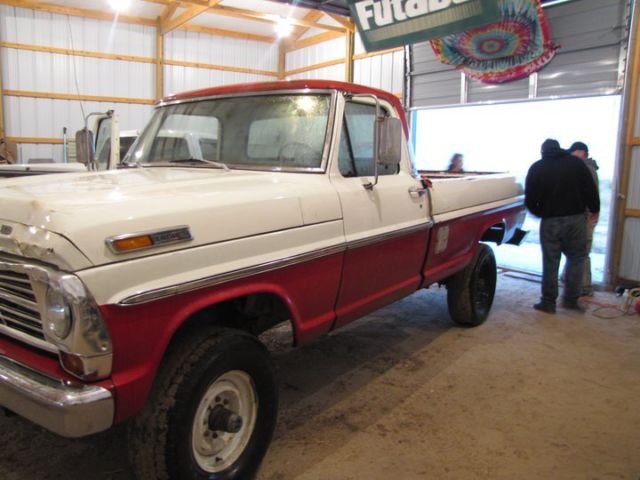 1969 red and white Ford F-250 pickup