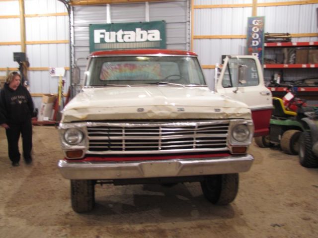 1969 red and white Ford F-250 pickup