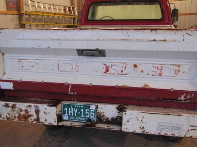 1969 red and white Ford F-250 pickup