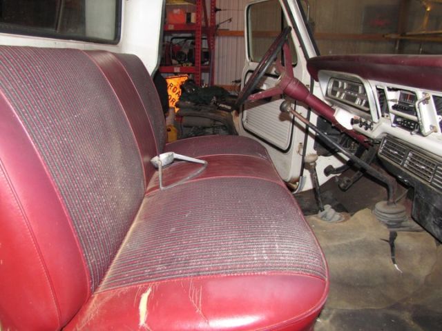 1969 red and white Ford F-250 pickup