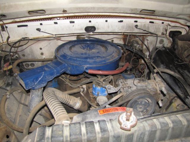 1969 red and white Ford F-250 pickup