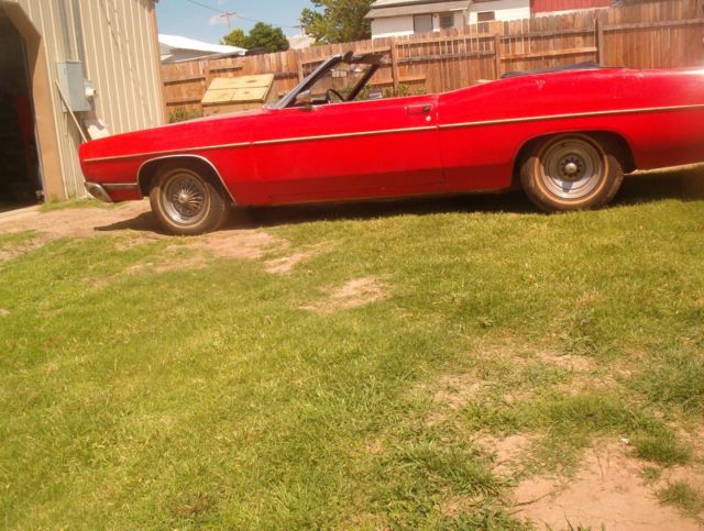 1969 red Ford ltd Convertible
