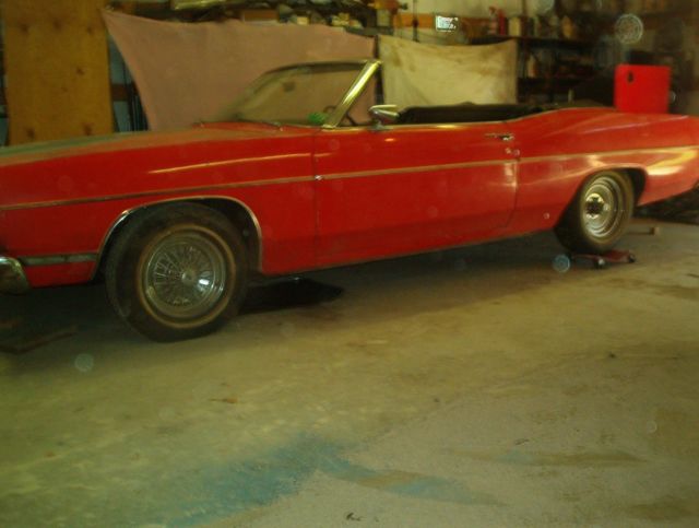 1969 red Ford ltd Convertible