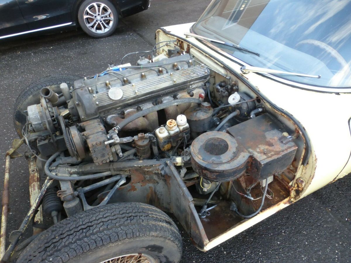 1969 Yellow Jaguar XK Coupe
