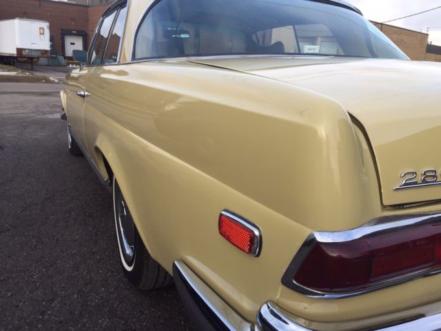 1969 Yellow Mercedes-Benz 200-Series Coupe