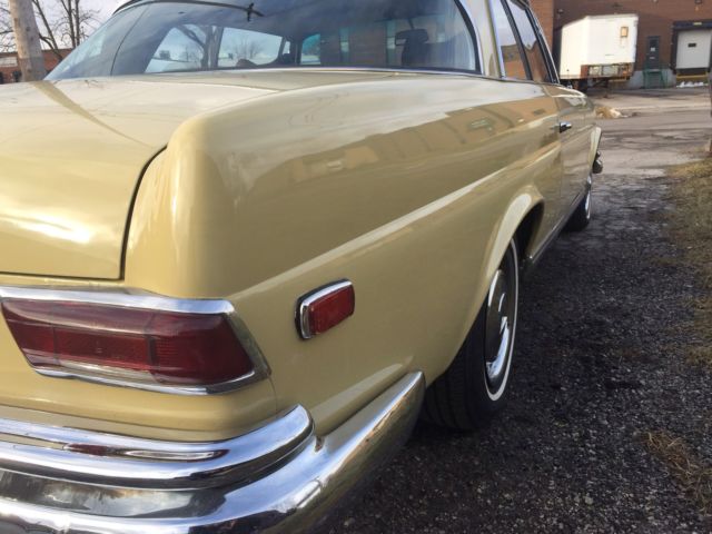 1969 Yellow Mercedes-Benz 200-Series Coupe