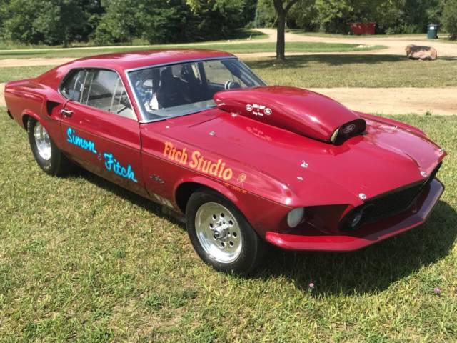 1969 Burgundy Ford Mustang Fastback
