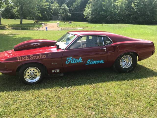 1969 Burgundy Ford Mustang Fastback